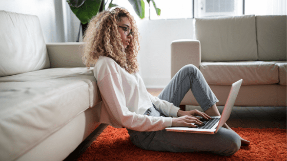 a woman typing on her laptop